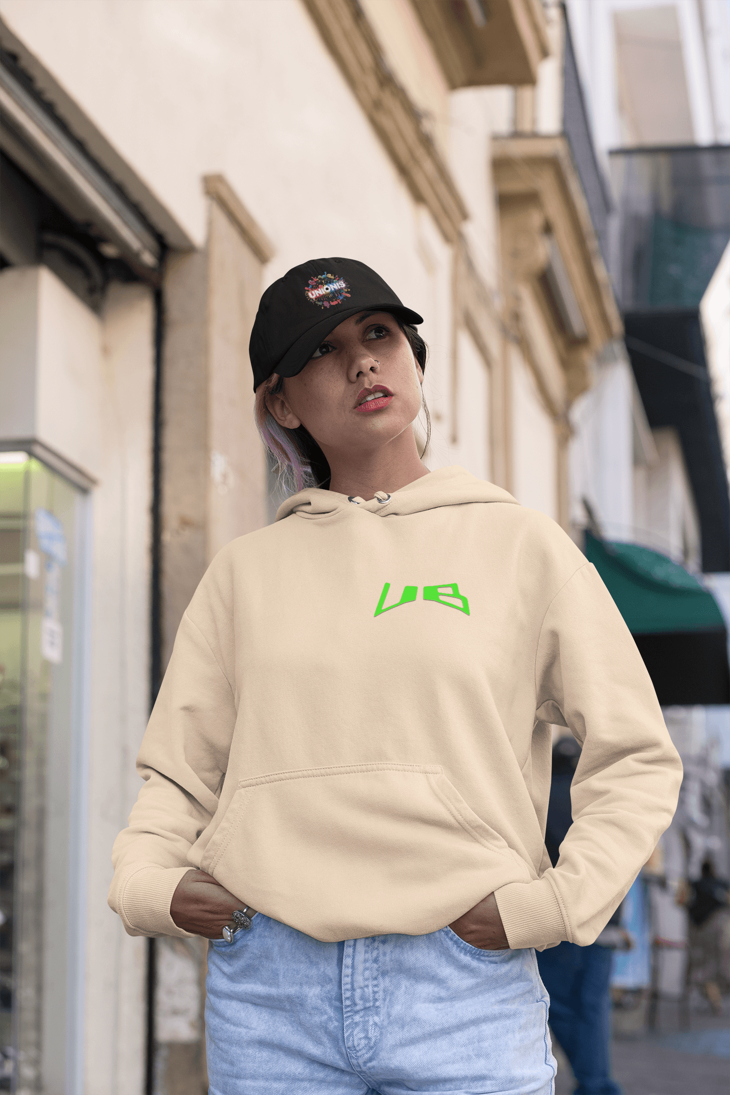 Beige unisex oversize hoodie in policotone 320gr with small Unionis logo, offering comfortable fit for casual street style.